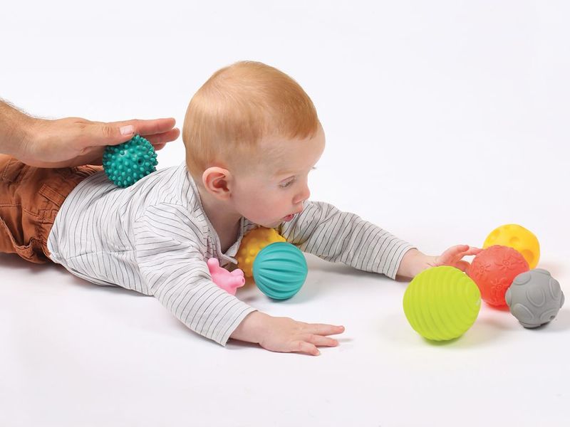 sensory play - photo of baby playing with sensory balls