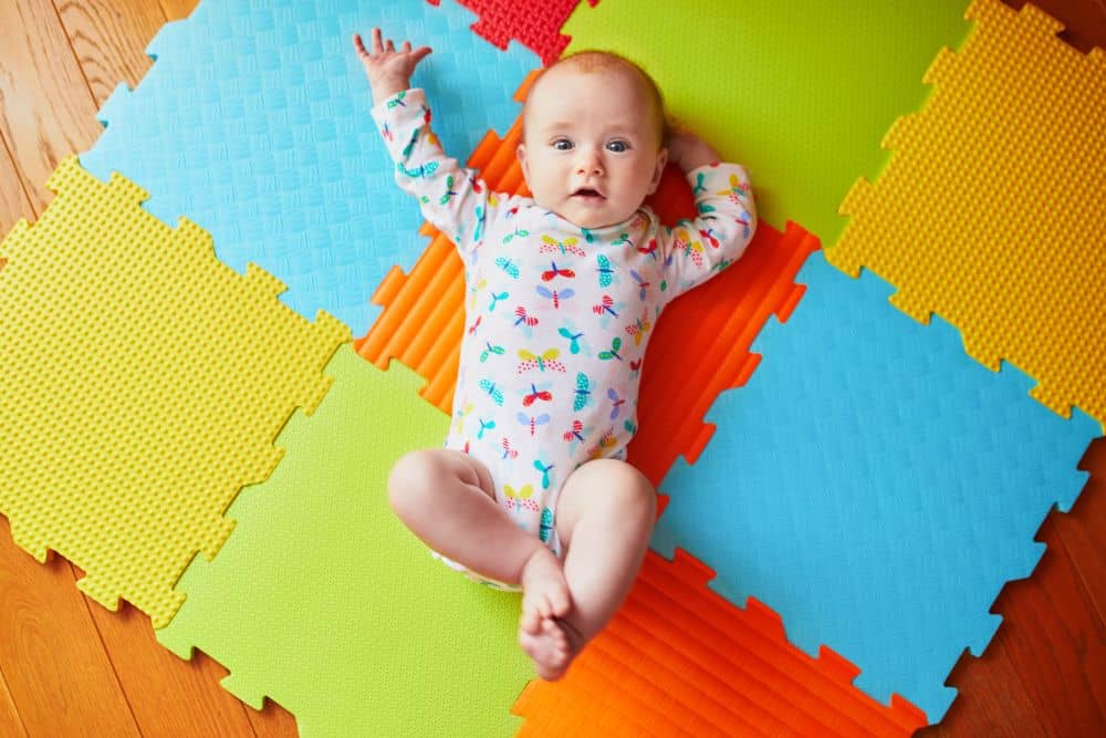 baby wriggling on baby play mat