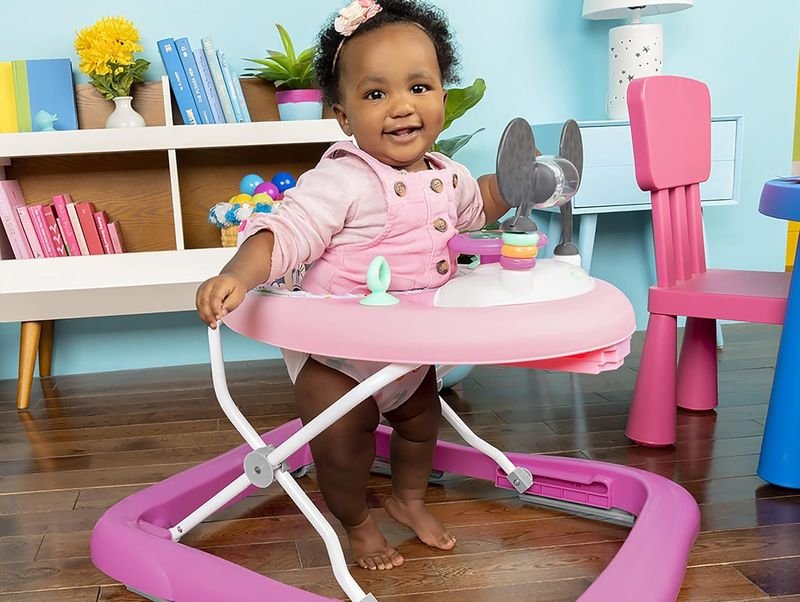baby playing in the disney minnie walker